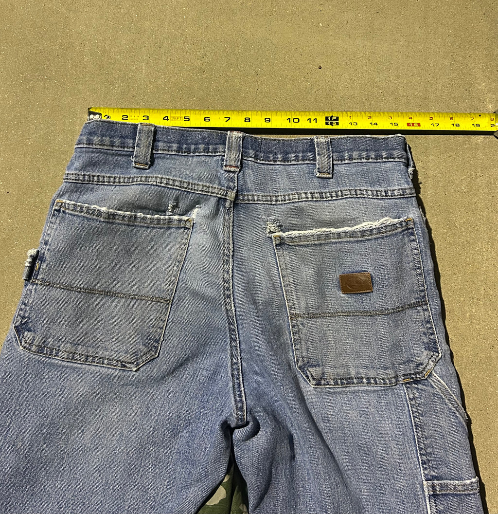 Blue jeans with camo inserts